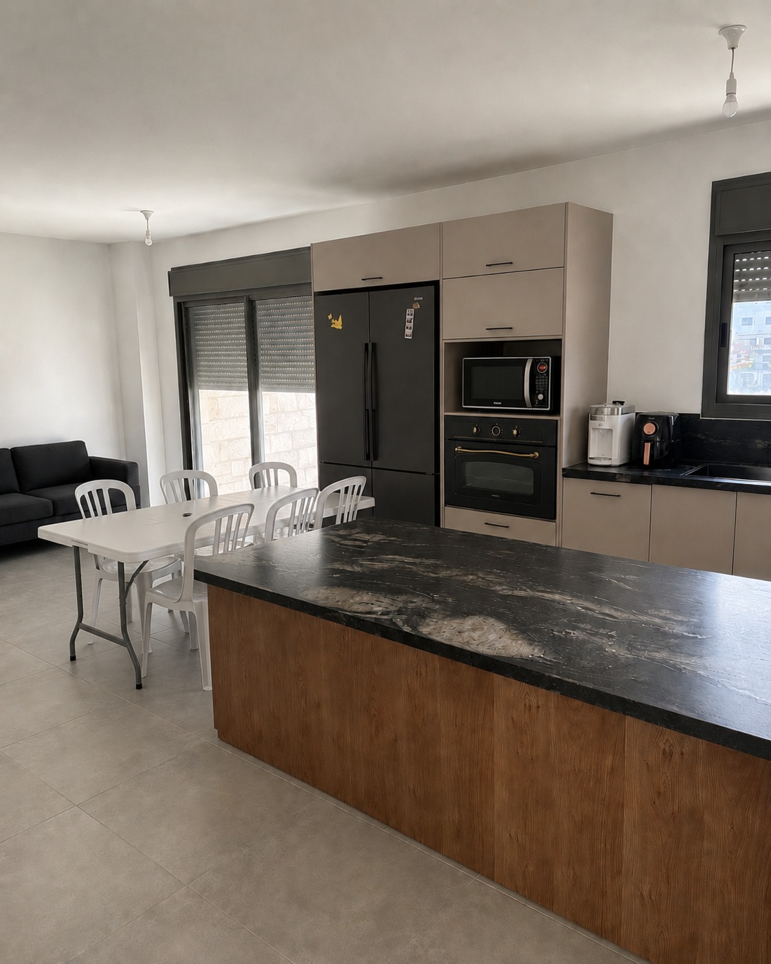 Shared kitchen with appliances and dining space